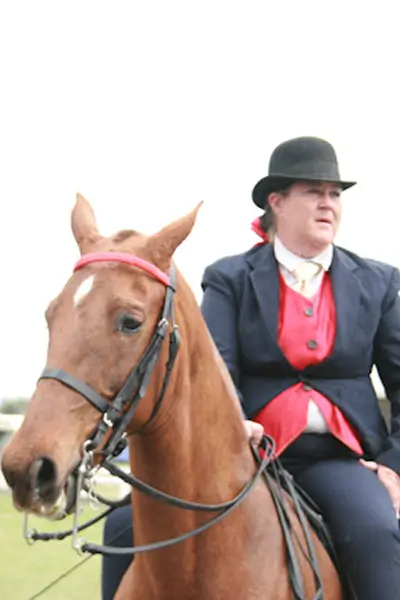Friendly instructor Leoni with a horse